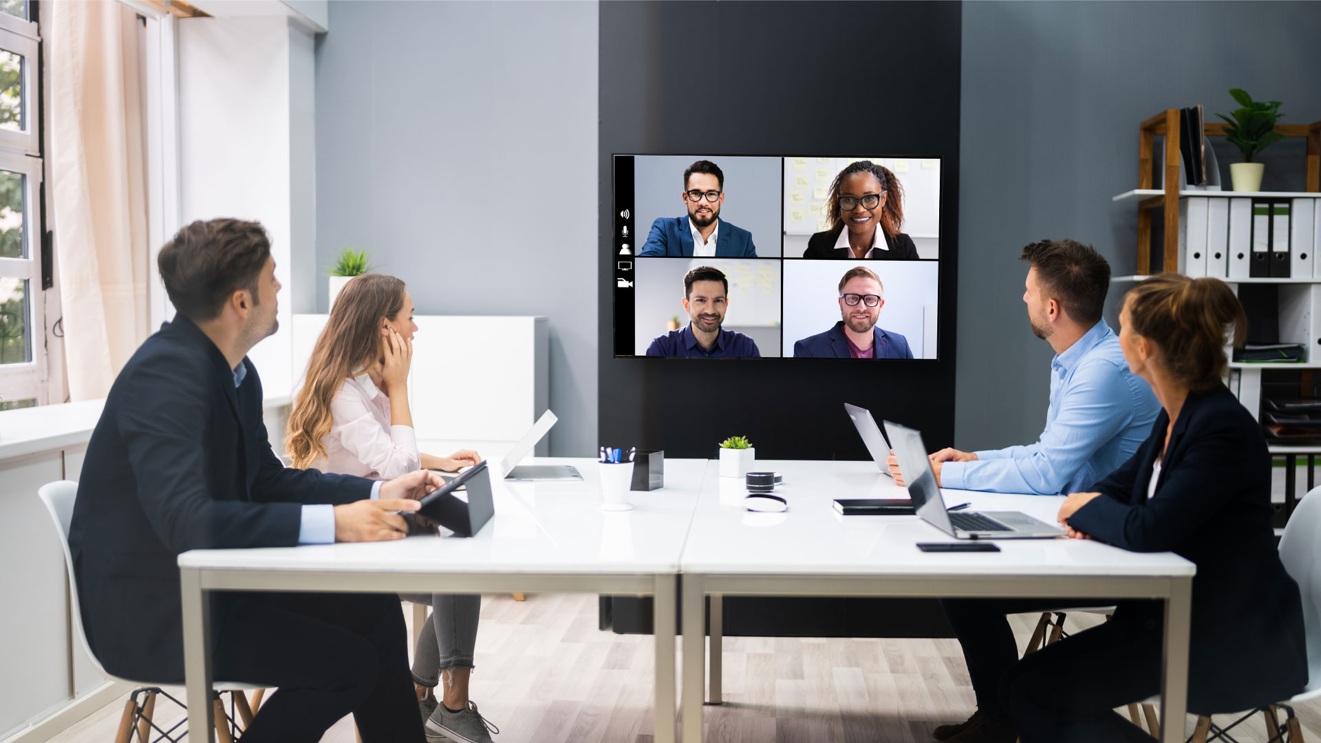 Executive team participating in a hybrid video meeting